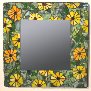 Square mirror with a mosaic frame featuring yellow and orange flowers and green leaves made from glass tiles.
