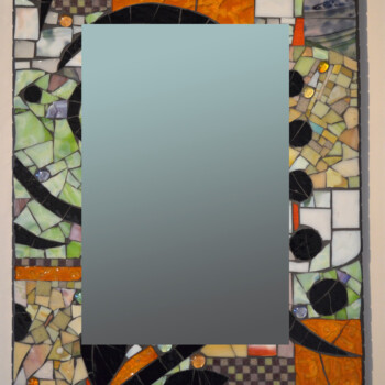 Rectangular mirror with a colorful mosaic frame featuring geometric shapes and patterns in black, orange, green, and cream.