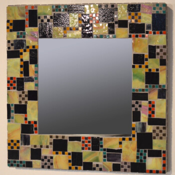 Square mirror with a border of colorful mosaic tiles in various shapes and sizes on a neutral background.