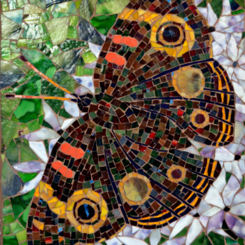 A mosaic artwork of a butterfly with patterned wings set against a green and white background.