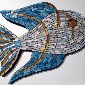 Mosaic artwork of a fish made from blue, white, and brown tiles arranged on a white background.