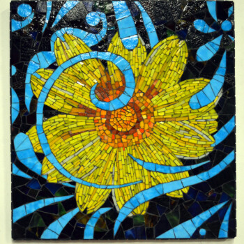 Mosaic artwork of a yellow flower with blue swirls and patterns on a dark background.