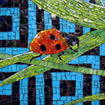 A mosaic depicts a red ladybug with black spots on green blades of grass against a blue background.