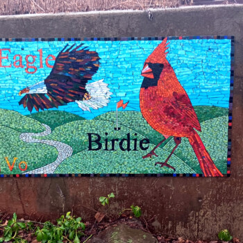 SOLD A mosaic shows an eagle and a cardinal with the words "Eagle" and "Birdie" on a golf course background.