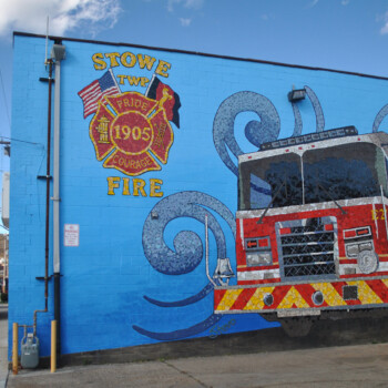 SOLD A mural of a fire truck and emblem is painted on the side wall of the Stowe Township Fire Department building.