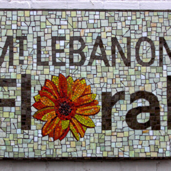 Mosaic sign reading "Mt Lebanon Floral" with a red and yellow flower replacing the letter "o" in "Floral.